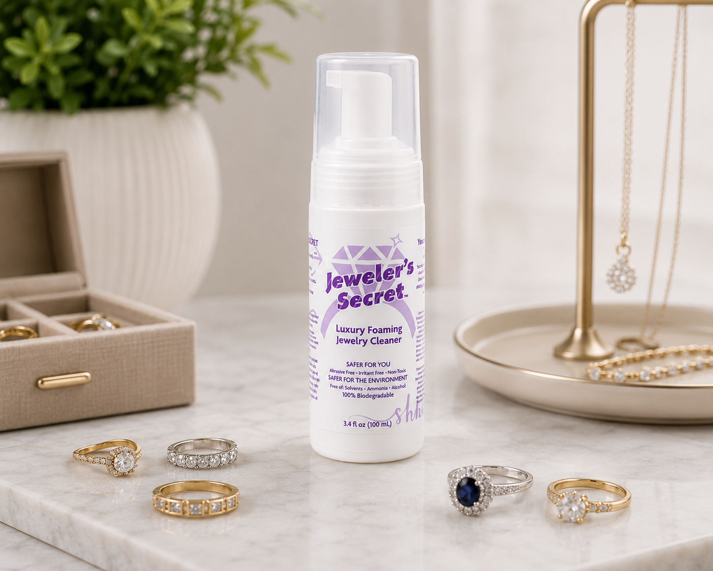 Jewelers Secret 3.4 o bottle on a bathroom counter with rings